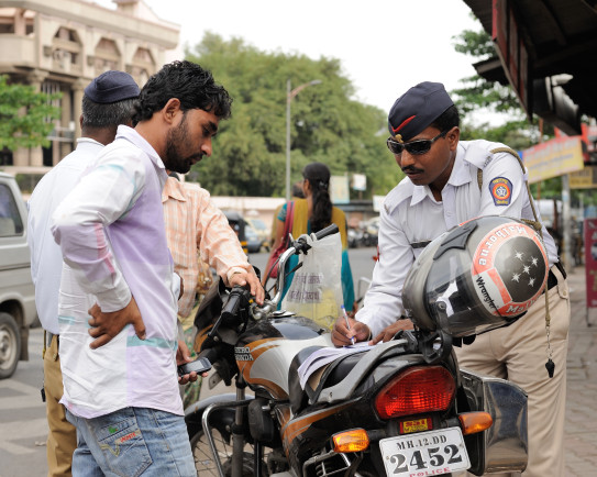 Unlicensed Driver pays bribe to get back on the road. 