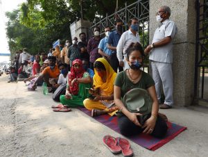 GURUGRAM, INDIA - JULY 10: People stand in queue to get vaccinated against Covid-19, outside a community centre at Sukhrali near IFFCO Chowk, on July 10, 2021 in Gurugram, India. (Photo by Vipin Kumar/Hindustan Times